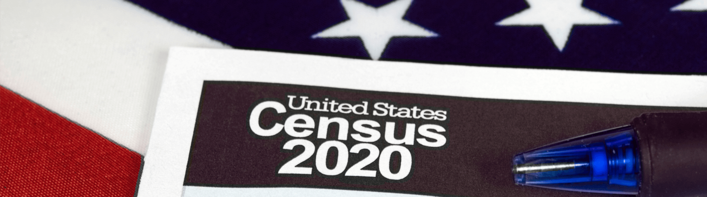 Image of American Flag with the words "United States Census 2020" on top of it.