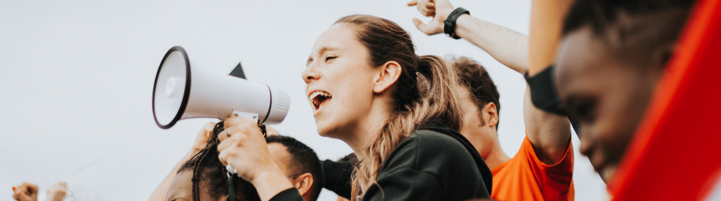 A young person using a megaphone.