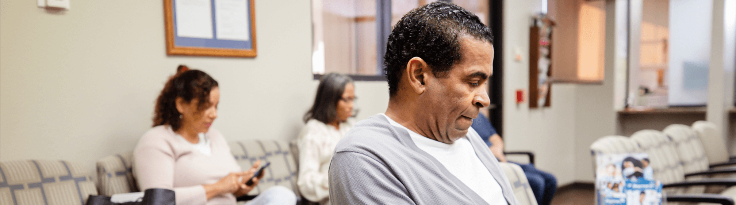 People sitting in a waiting room.