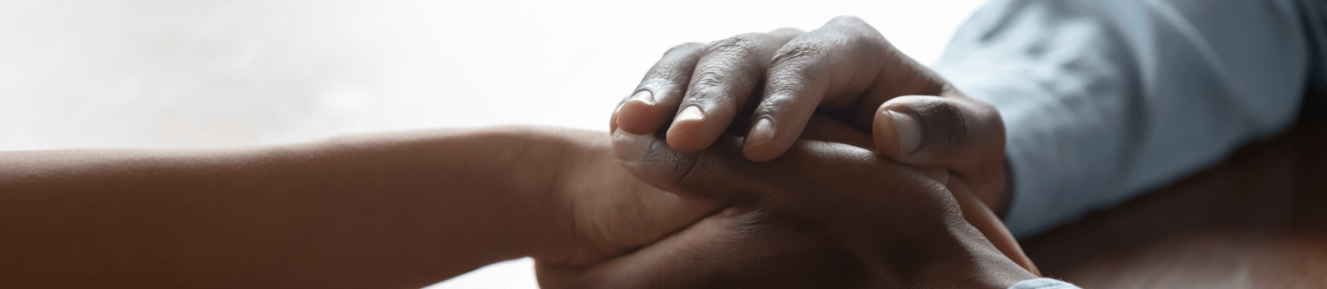 Two people holding hands.