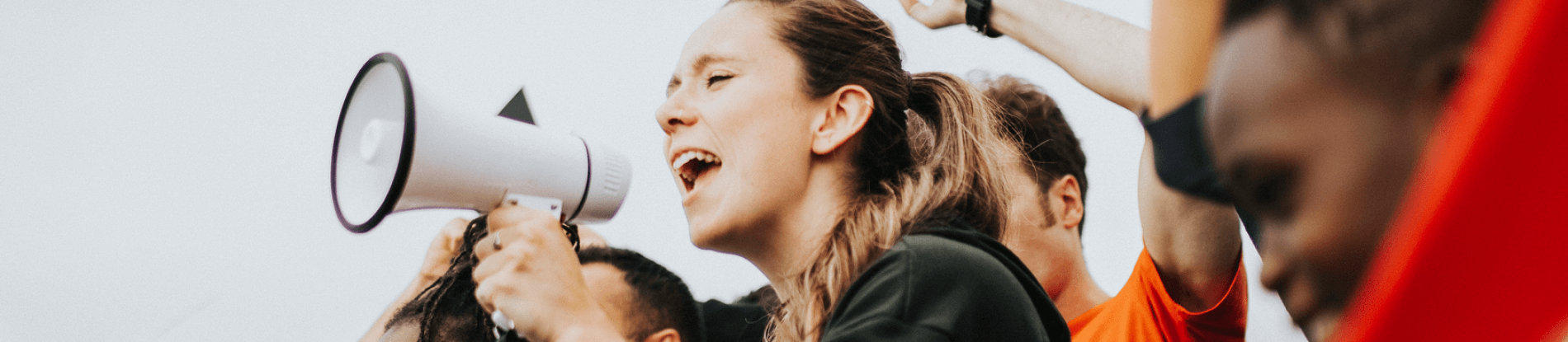 A young person using a megaphone.