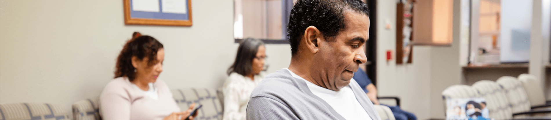 People sitting in a waiting room.