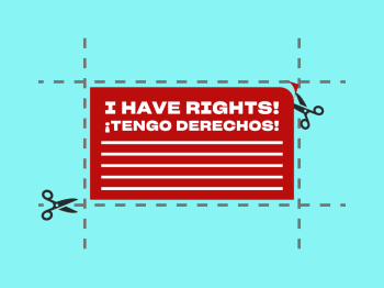 An image of a red card, with cut lines around the edges. There's a pair of scissors in the bottom left hand corner.